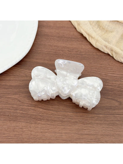 Beau bow shaped hair claw clip displayed on a white background