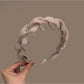 Pink tulle braided headband with soft fabric texture on white background
