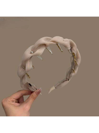 Pink tulle braided headband with soft fabric texture on white background