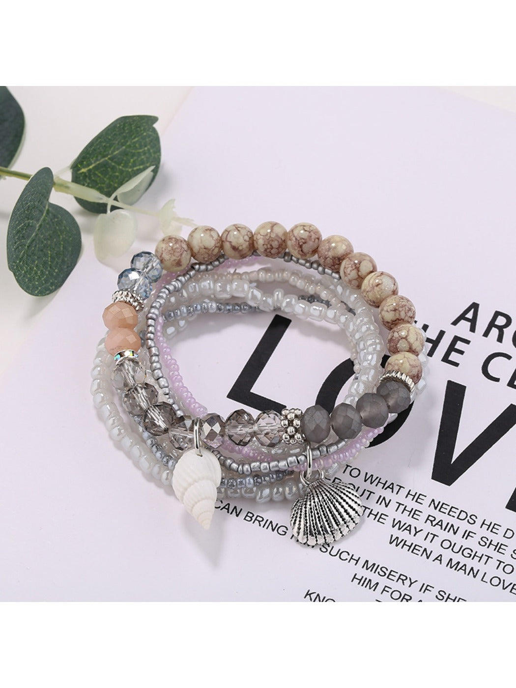 Lovra stackable bracelet layered with other bracelets on wrist