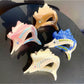 Side view of Beau cartoon sturgeon claw clip highlighting clip mechanism