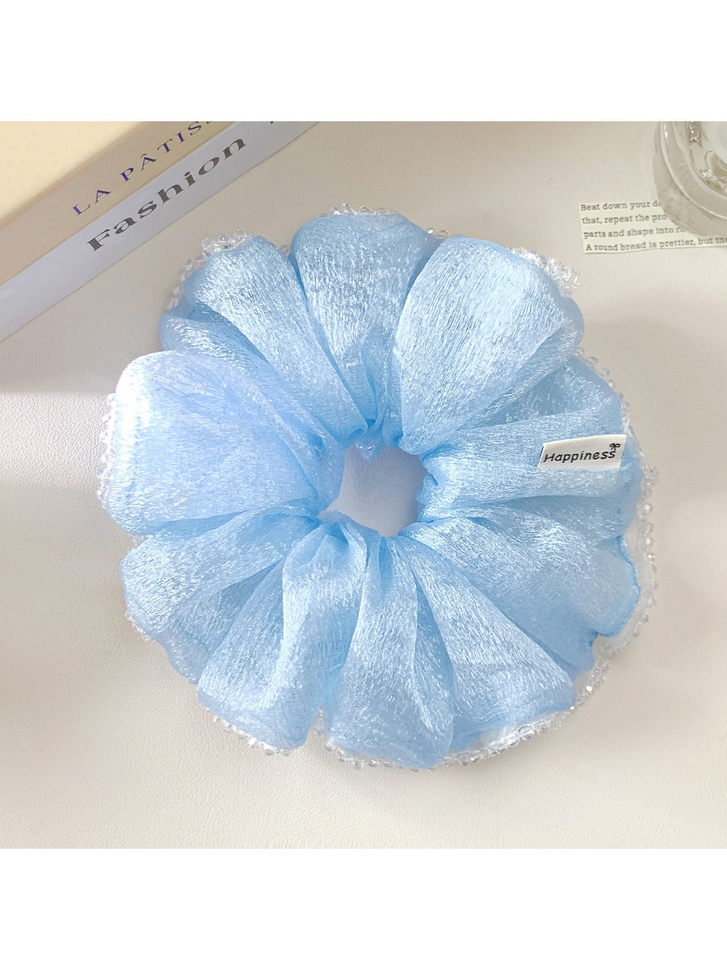 Gifty scrunchie styled in a ponytail on model with spring summer outfit