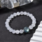 Side view of Lovra clear quartz beaded bracelet showing bead texture
