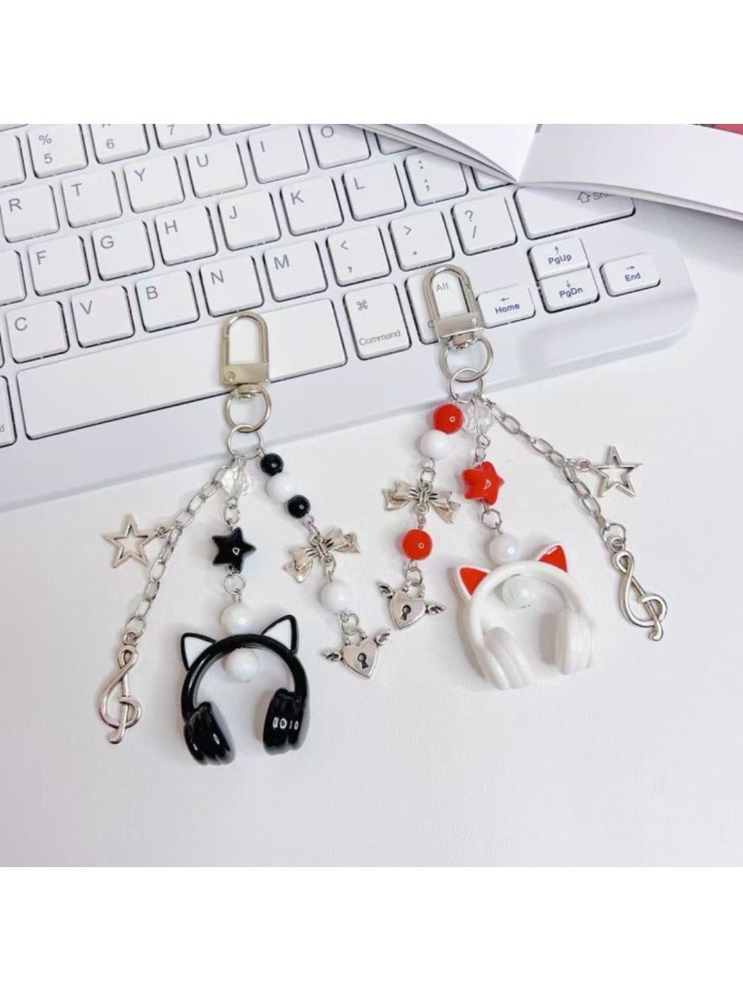 Minimalist over ear headphone pendant keychain in black with silver accents