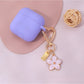 Keypus floral charm keychain held in hand showcasing size and design