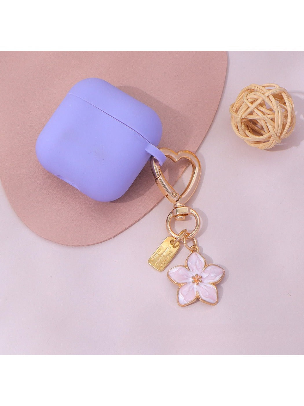 Keypus floral charm keychain held in hand showcasing size and design