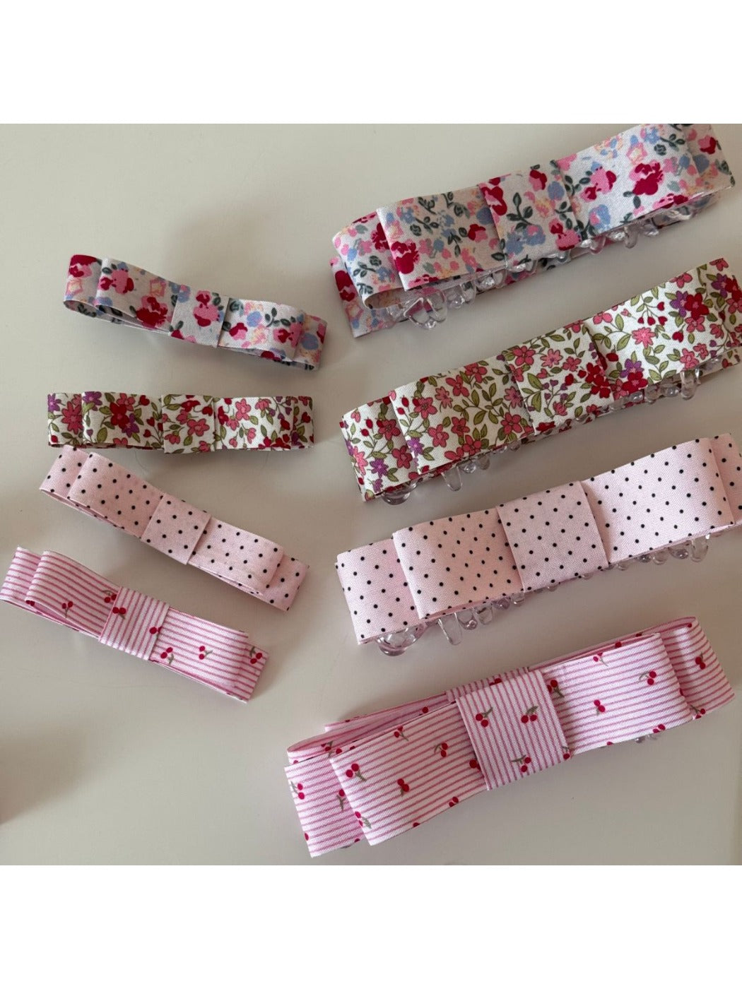 Side view of Beau pink floral hair clip with metal clasp