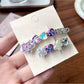Close-up of Beau rhinestone flower hair clip with sparkling clear stones on gold-tone metal