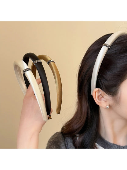 Model wearing Gifty satin headband styled with loose hair and casual outfit