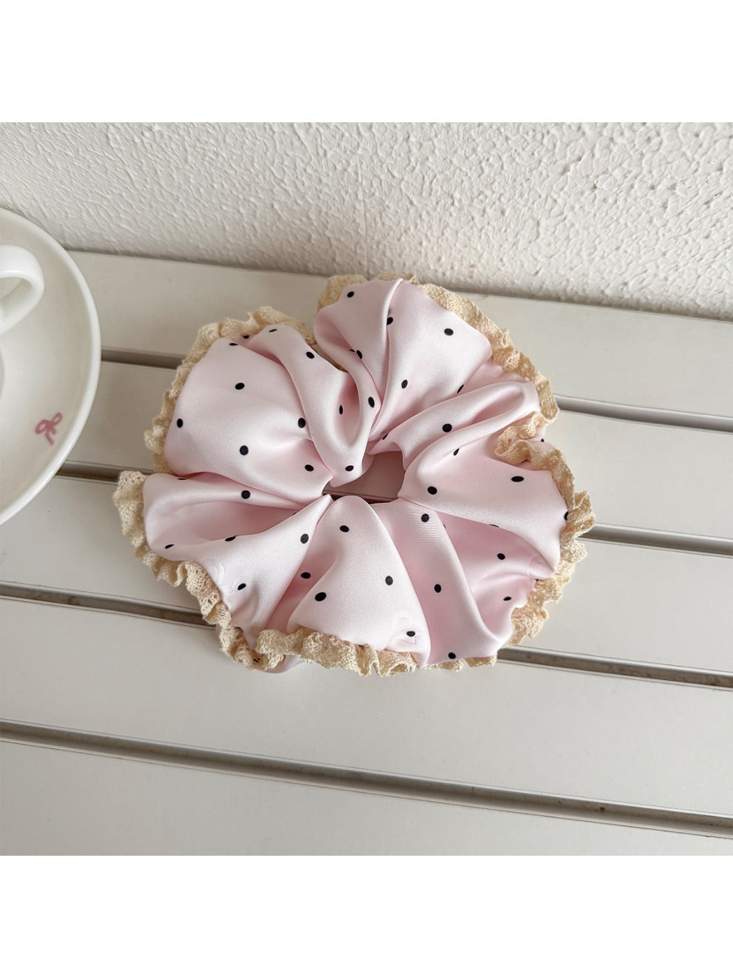 Side view of Gifty polka dot scrunchie showing lace detail and elastic band