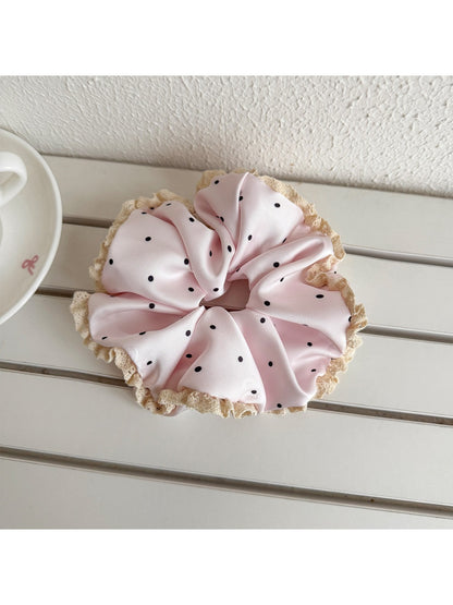 Side view of Gifty polka dot scrunchie showing lace detail and elastic band