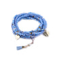Lovra bracelet displayed on a hand with natural lighting emphasizing pendant shape
