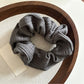 Gifty scrunchie folded to show striped pattern and soft fabric