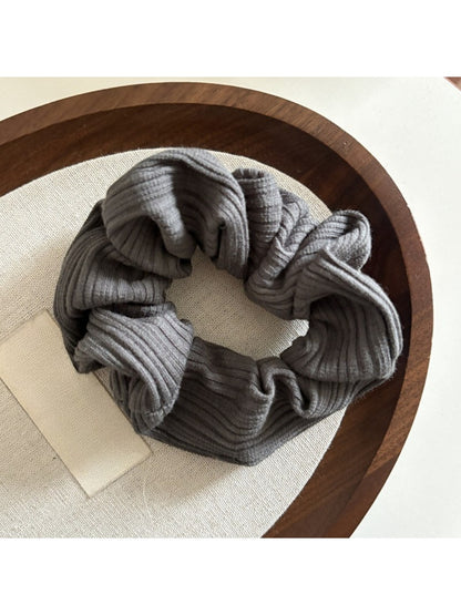 Gifty scrunchie folded to show striped pattern and soft fabric