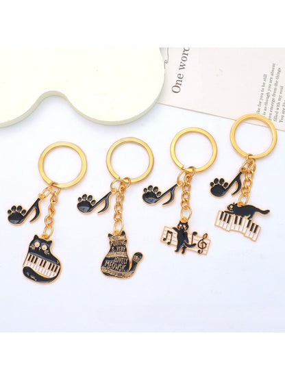 Side view of cartoon cat piano keychain showing keyring attachment