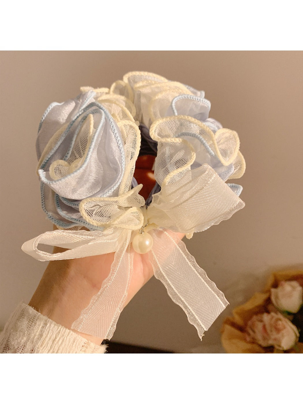 Soft lace bow hair tie displayed flat showing elastic band