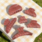 Beau plaid hair claw clip with red strawberry print on fabric