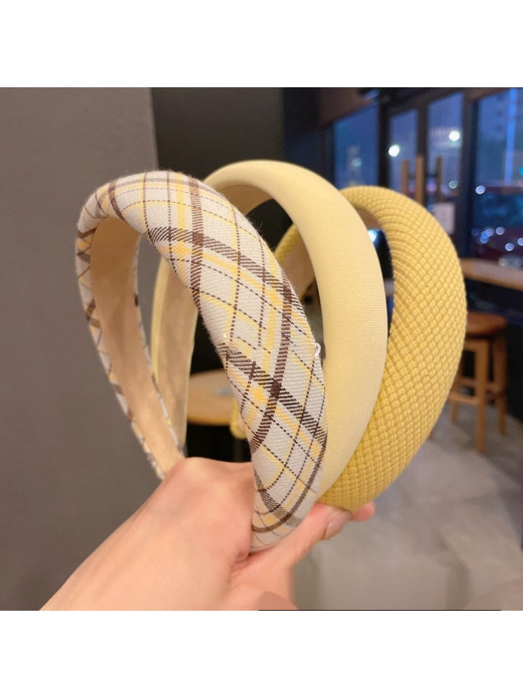 Yellow headband styled on a mannequin head with hair