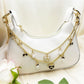 Minimalist heart-shaped bow pendant bag charm in soft pink leather with gold hardware