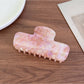 Beau gradient acetate claw clip angled to show both the outer surface and inner teeth