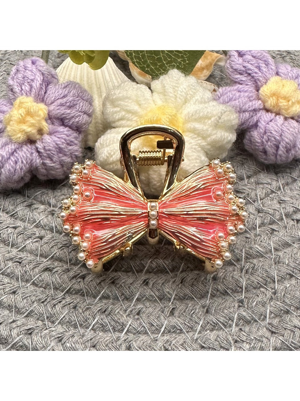 Beau hair clip worn in long brown hair, highlighting bow shape and size