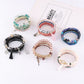 Lovra vintage beaded bracelet worn on wrist with tassel charm visible