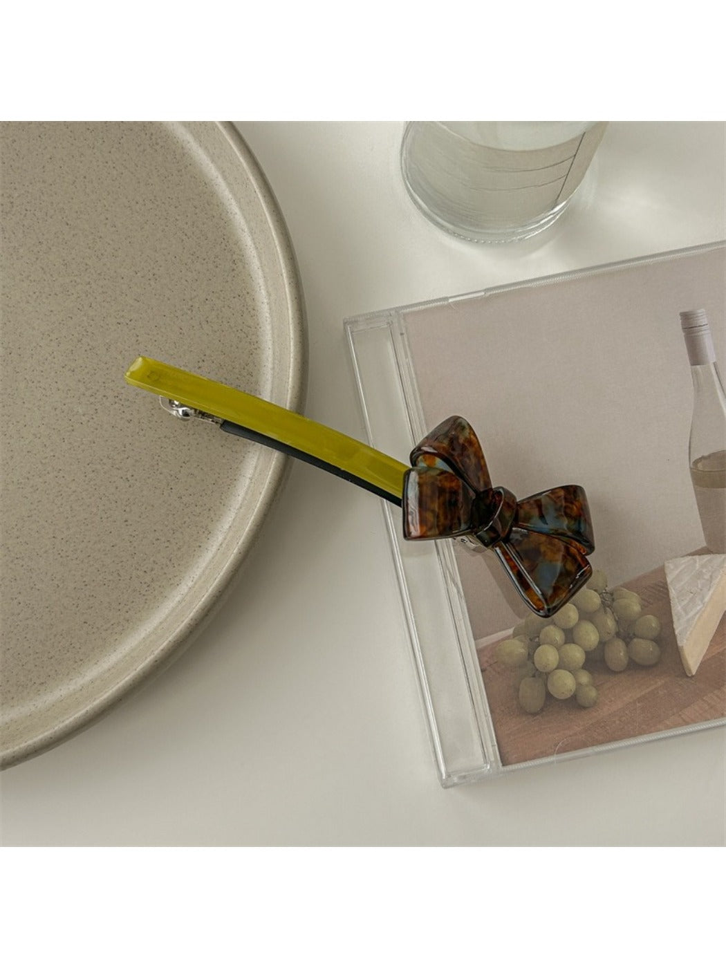 Top view of Beau bow bar hair clip displaying symmetrical bow shape and glossy finish