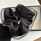Gifty scrunchie displayed alongside matching minimalist accessories on a light surface