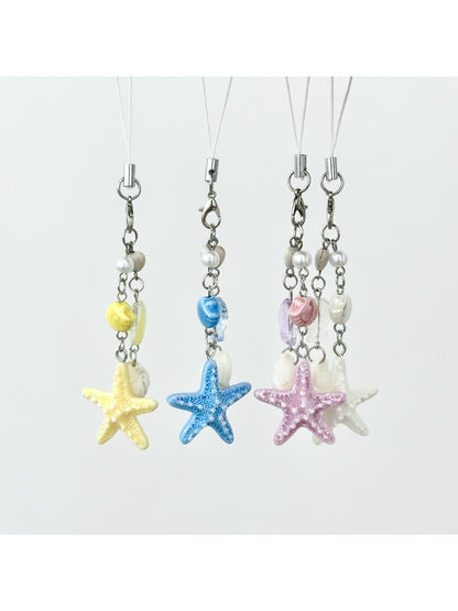 Mini starfish keychain attached to a set of keys