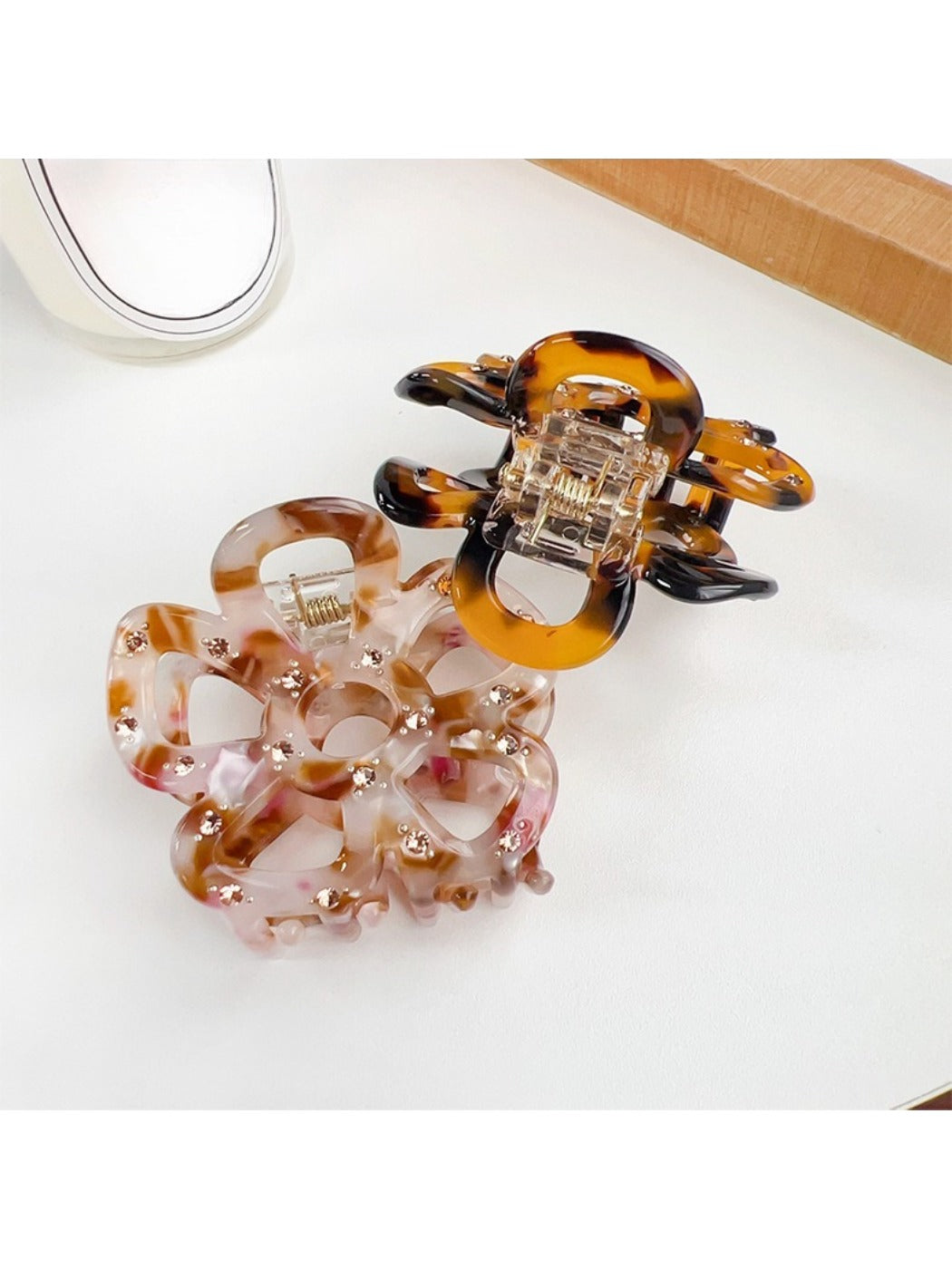 Beau hair claw clip displayed on a wooden surface with natural lighting