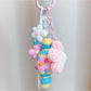 Close-up of crochet candy keychain showing detailed stitching and soft yarn texture