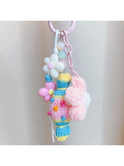 Close-up of crochet candy keychain showing detailed stitching and soft yarn texture