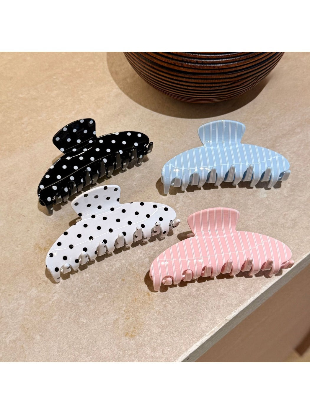 Beau Sweet Polka Dot Stripe Claw Clip held in hand showing size and grip