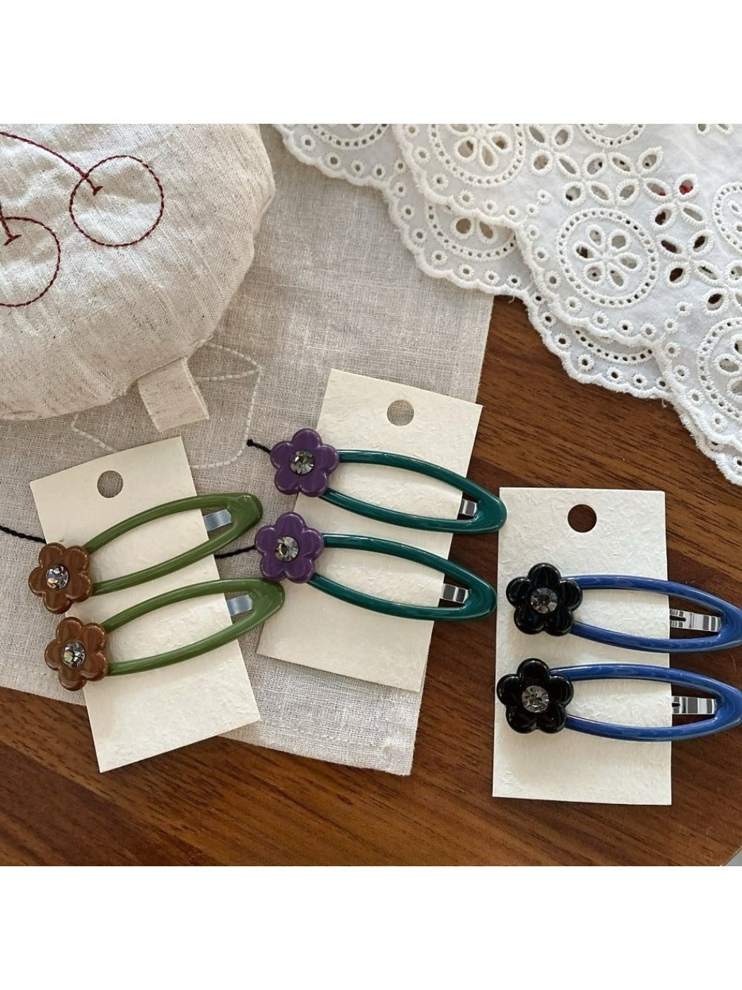 Side view of Beau hair clip featuring colorful flower pattern and metal clasp