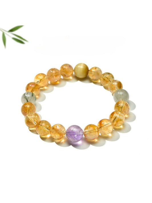 Lovra vintage bracelet with yellow citrine beads and multicolor block design on a white background