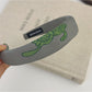 Side angle of Gifty embroidered flower headband showing flower arrangement