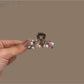Beau bright pretty hair clip with colorful floral design on a white background