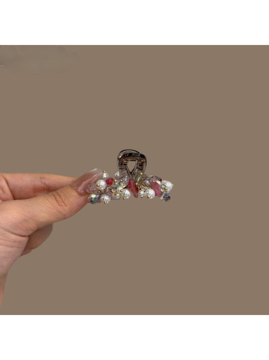 Beau bright pretty hair clip with colorful floral design on a white background