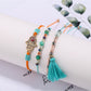 Lovra alloy charm tassel pendant bracelet worn on wrist