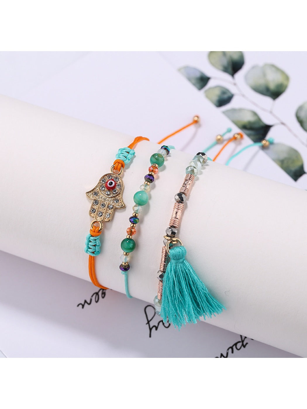 Lovra alloy charm tassel pendant bracelet worn on wrist