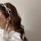 Model wearing the chic pink bow headband with loose hair