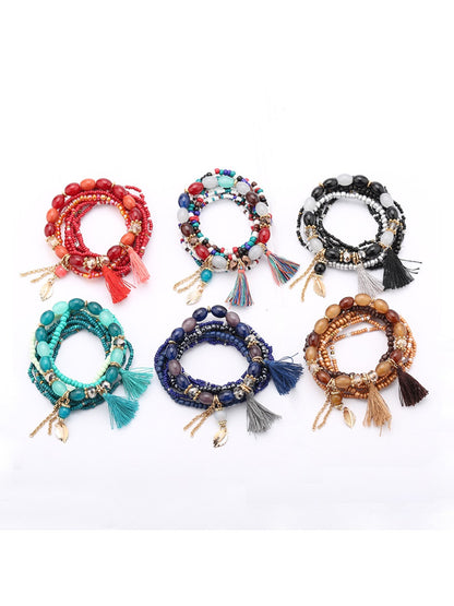 Lovra tassel pendant beaded bracelet with multicolored beads and gold-tone tassel