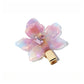 Beau chic leaf hair clip held in hand showing size and gold tone