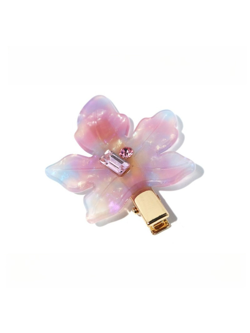 Beau chic leaf hair clip held in hand showing size and gold tone