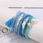 Lovra bracelet worn on wrist showing layered blue and white beads
