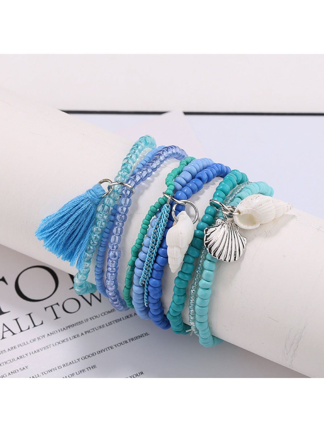Lovra bracelet worn on wrist showing layered blue and white beads