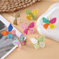 Close-up of Earedge butterfly shaped drop earrings in silver finish