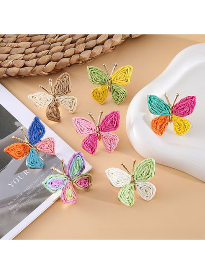 Close-up of Earedge butterfly shaped drop earrings in silver finish