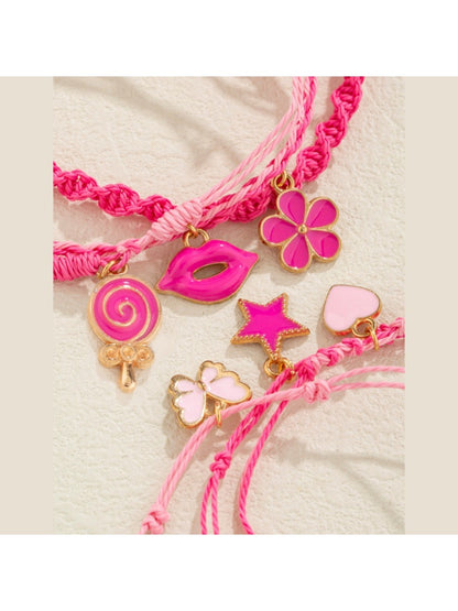 Close-up of Lovra pink pendant layered bracelet showing detailed pink pendant and chain links