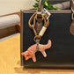 Fox charm keychain shown with a close-up of the metal clasp